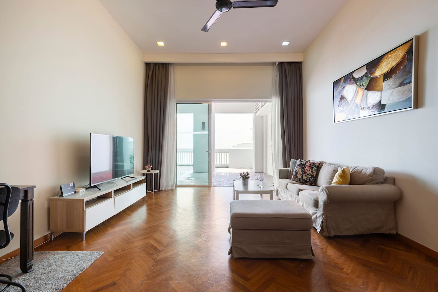 Bright living room with a sofa and sliding doors to the private terrace